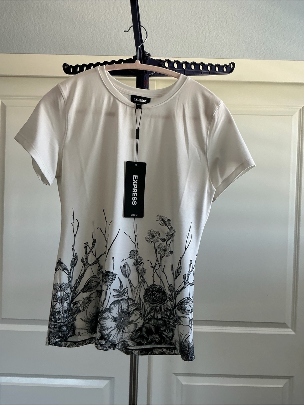 Express White Short Sleeve Crewneck Top with Black Floral Hem